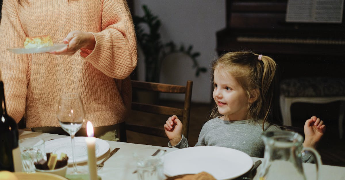 Girl in gray Long Sleeve Shirt Sitting by the Table